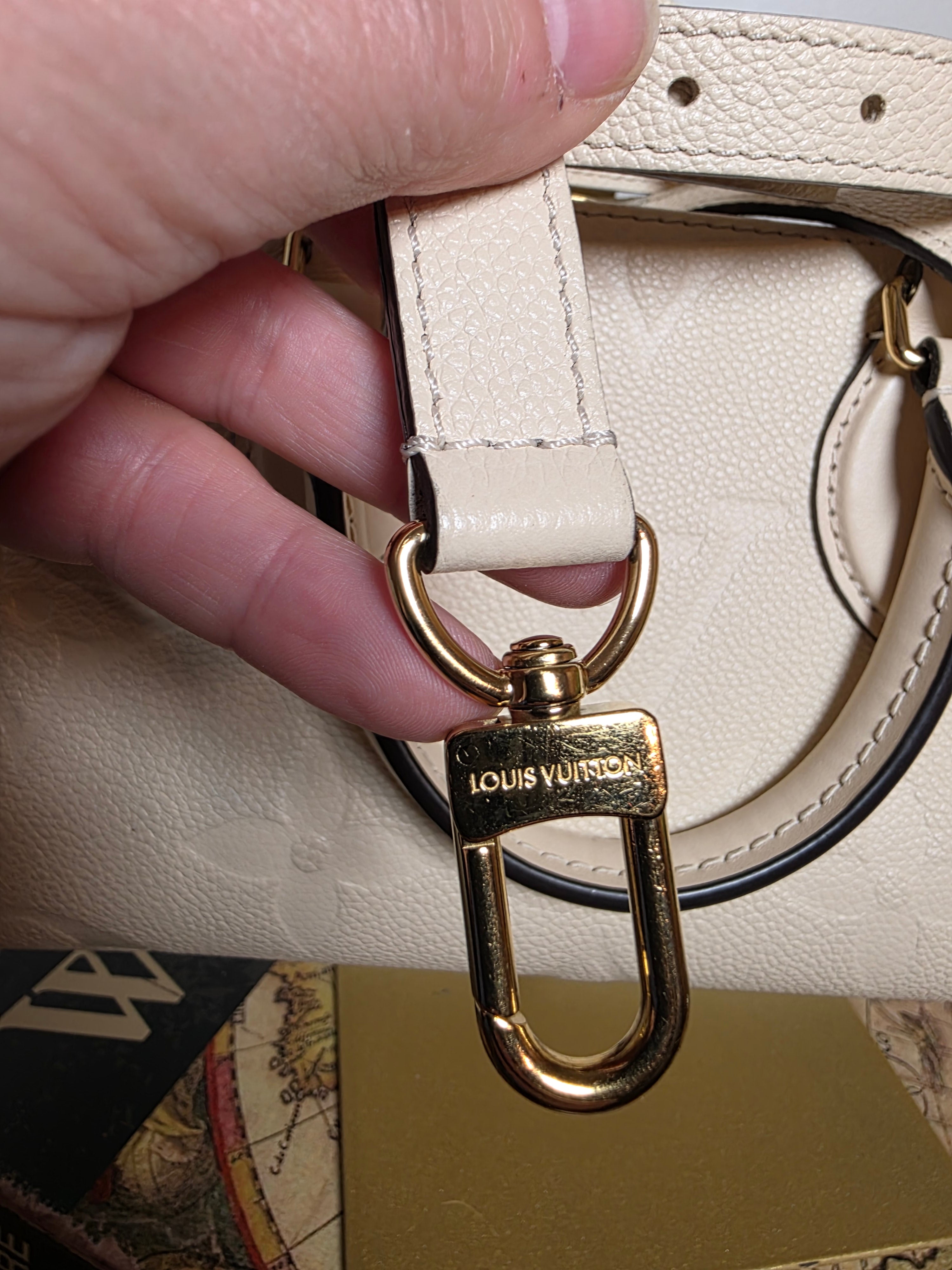 Louis Vuitton Creme Empreinte East West On The Go