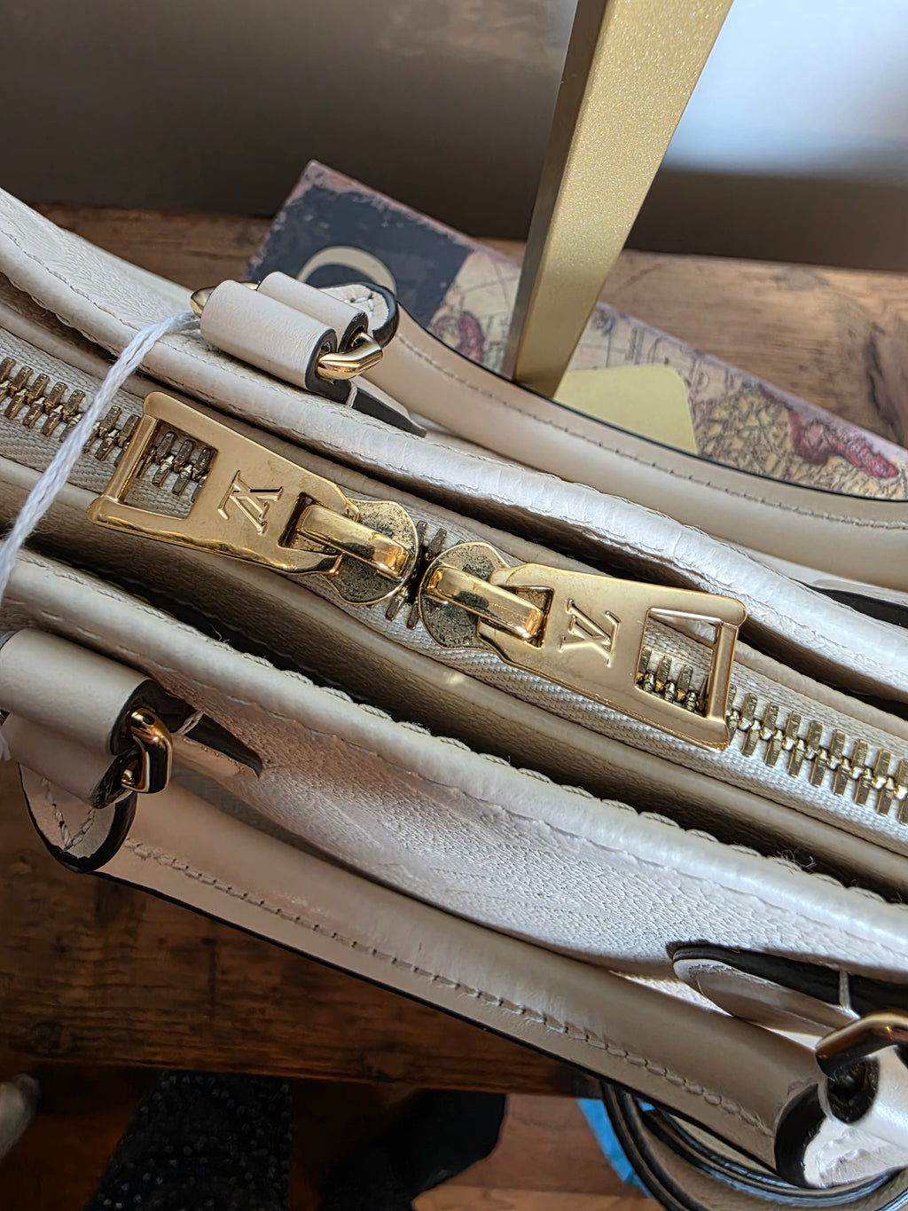 Louis Vuitton Creme Empreinte East West On The Go