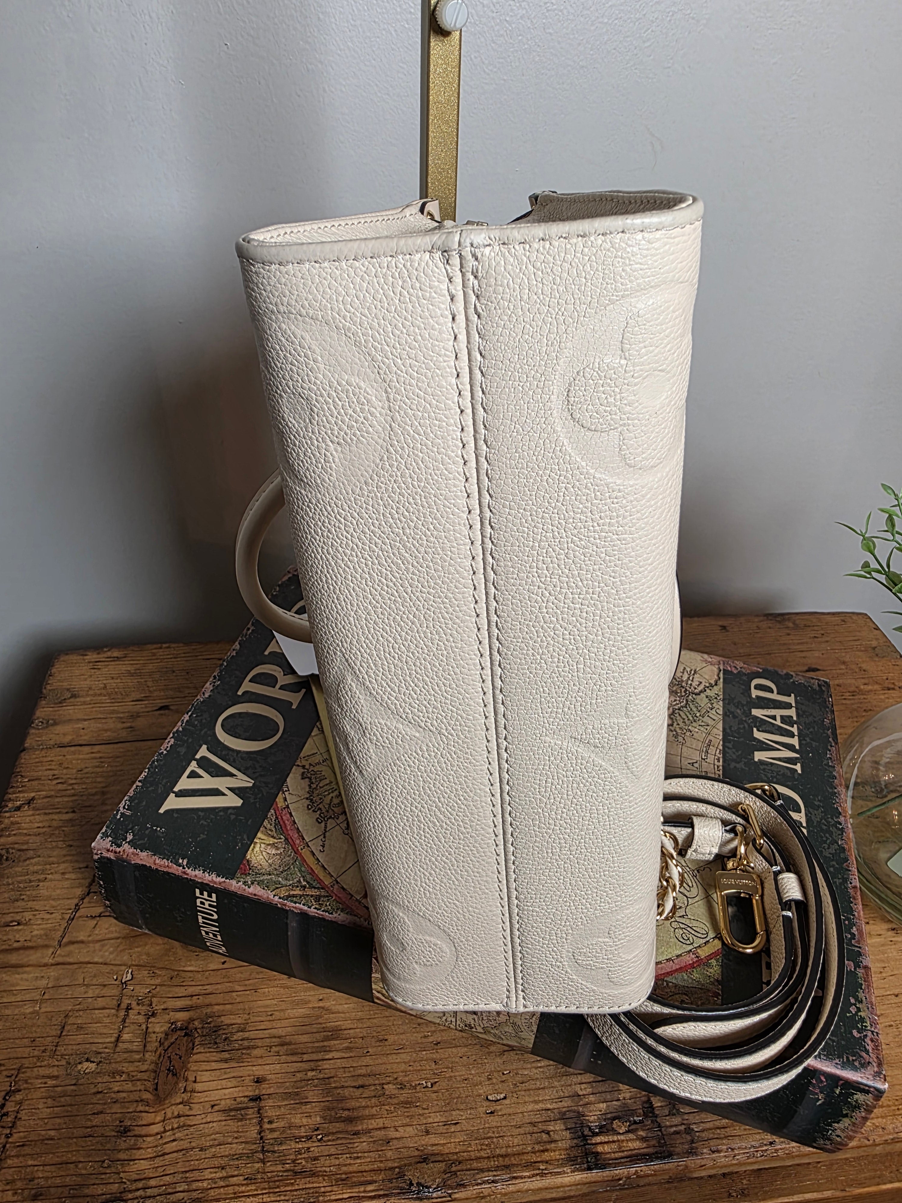 Louis Vuitton Creme Empreinte East West On The Go