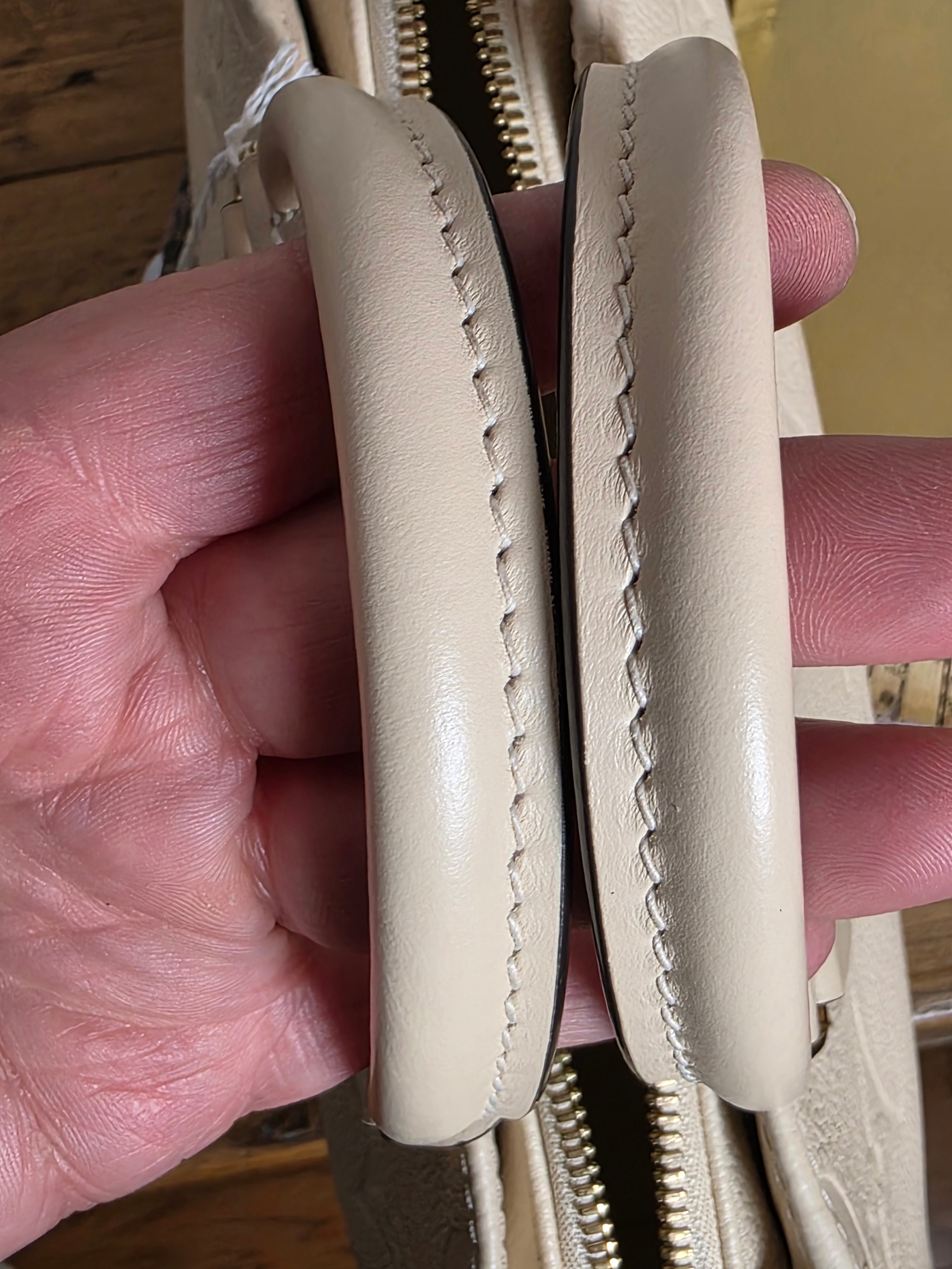 Louis Vuitton Creme Empreinte East West On The Go