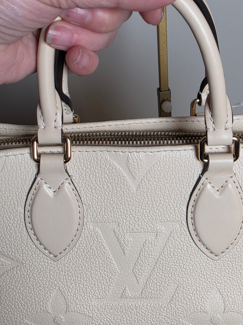 Louis Vuitton Creme Empreinte East West On The Go